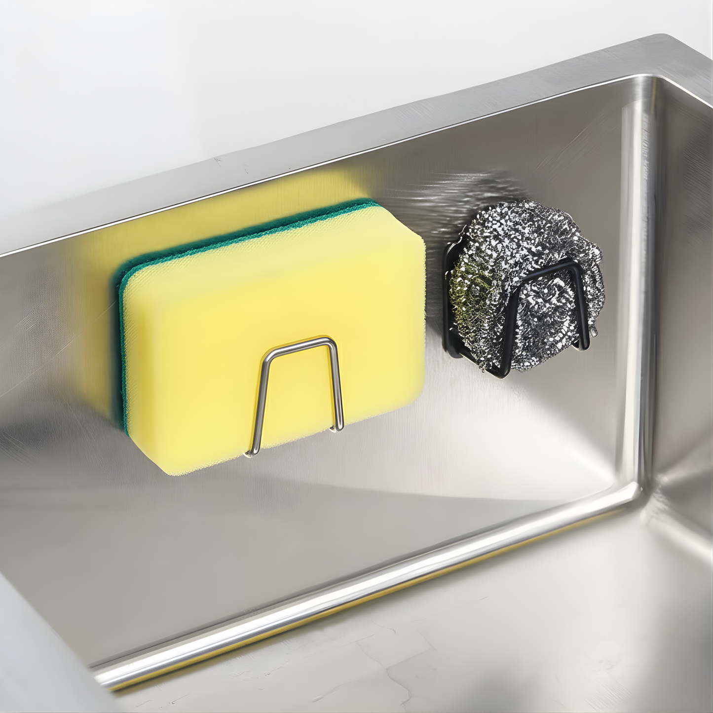 Close-up of AquaHold™ Sponge Holder with sponge and steel scrubber